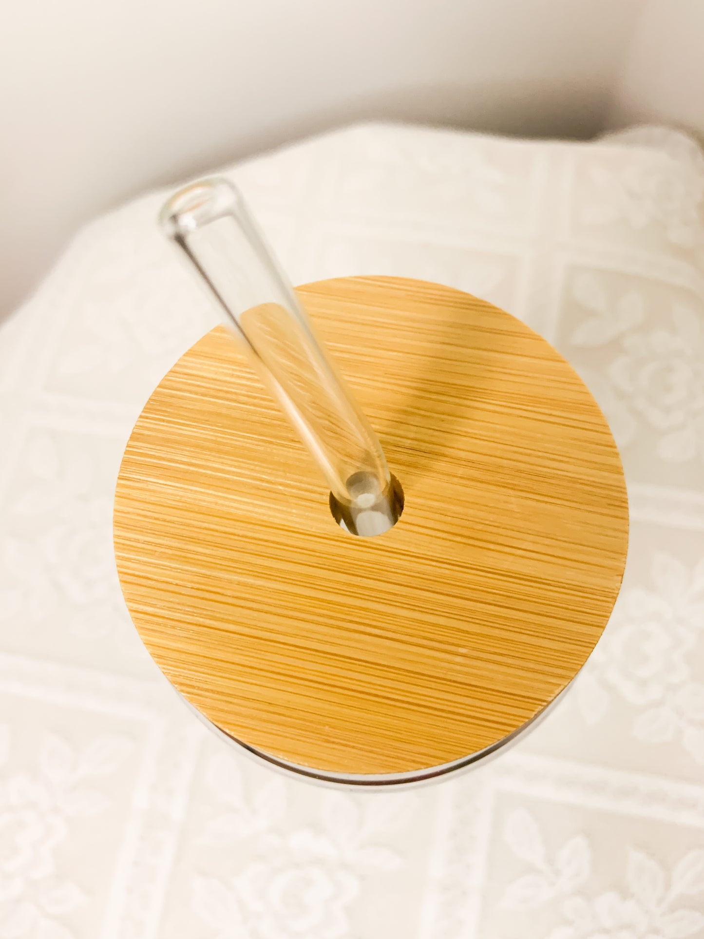 Glass cup with straw and medical design