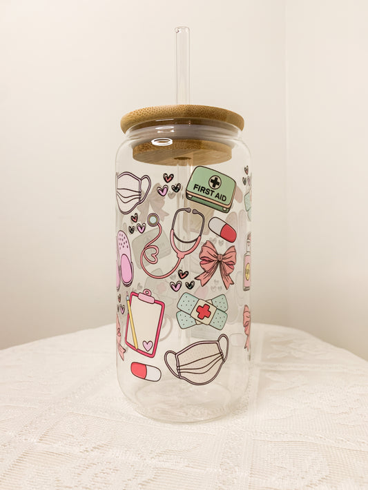 Glass cup with straw and medical design
