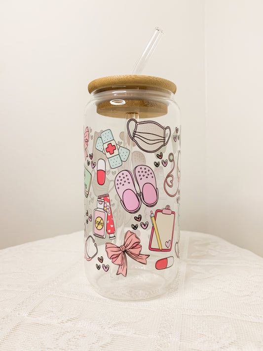 Glass cup with straw and medical design