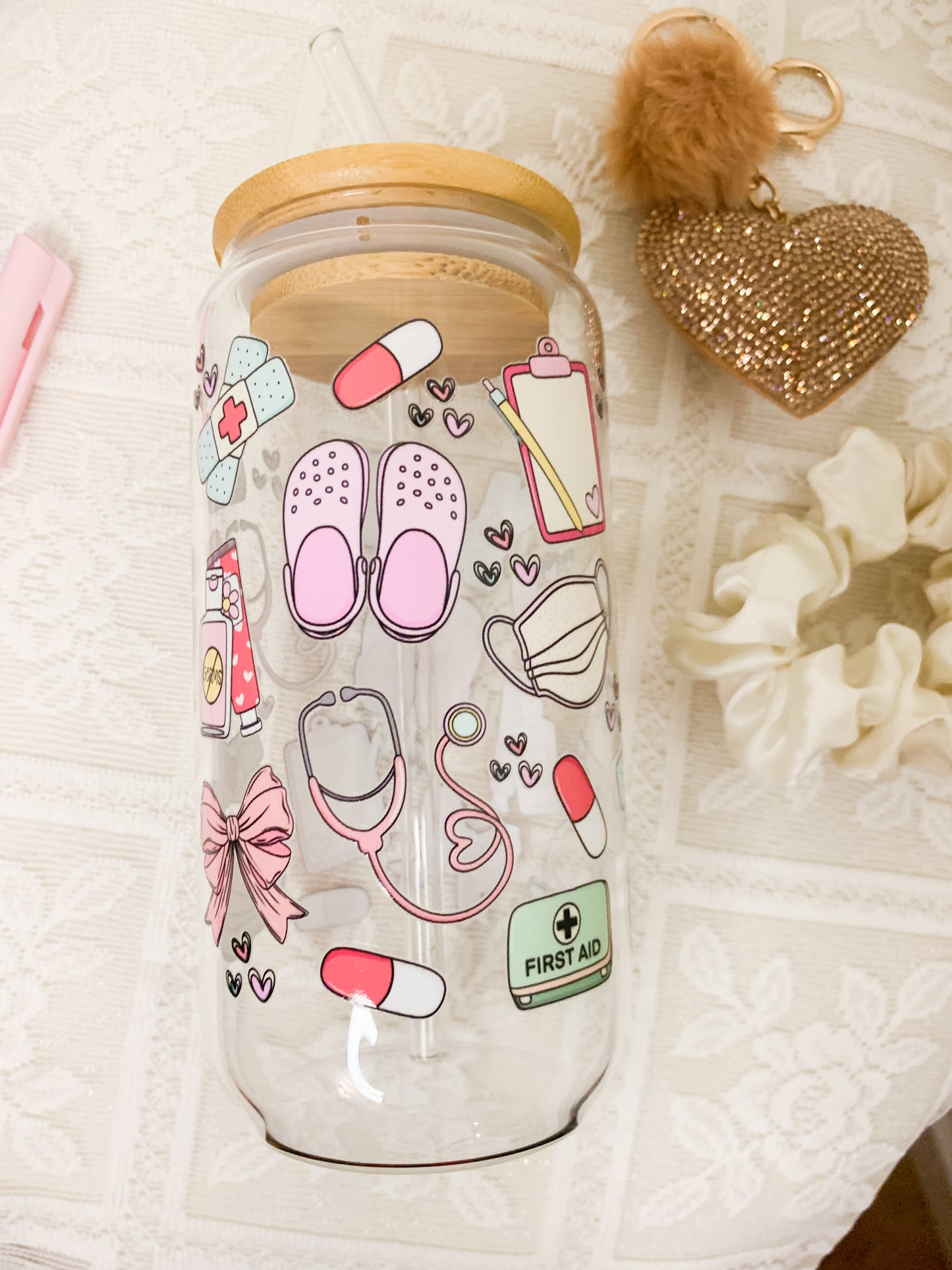 Glass cup with straw and medical design